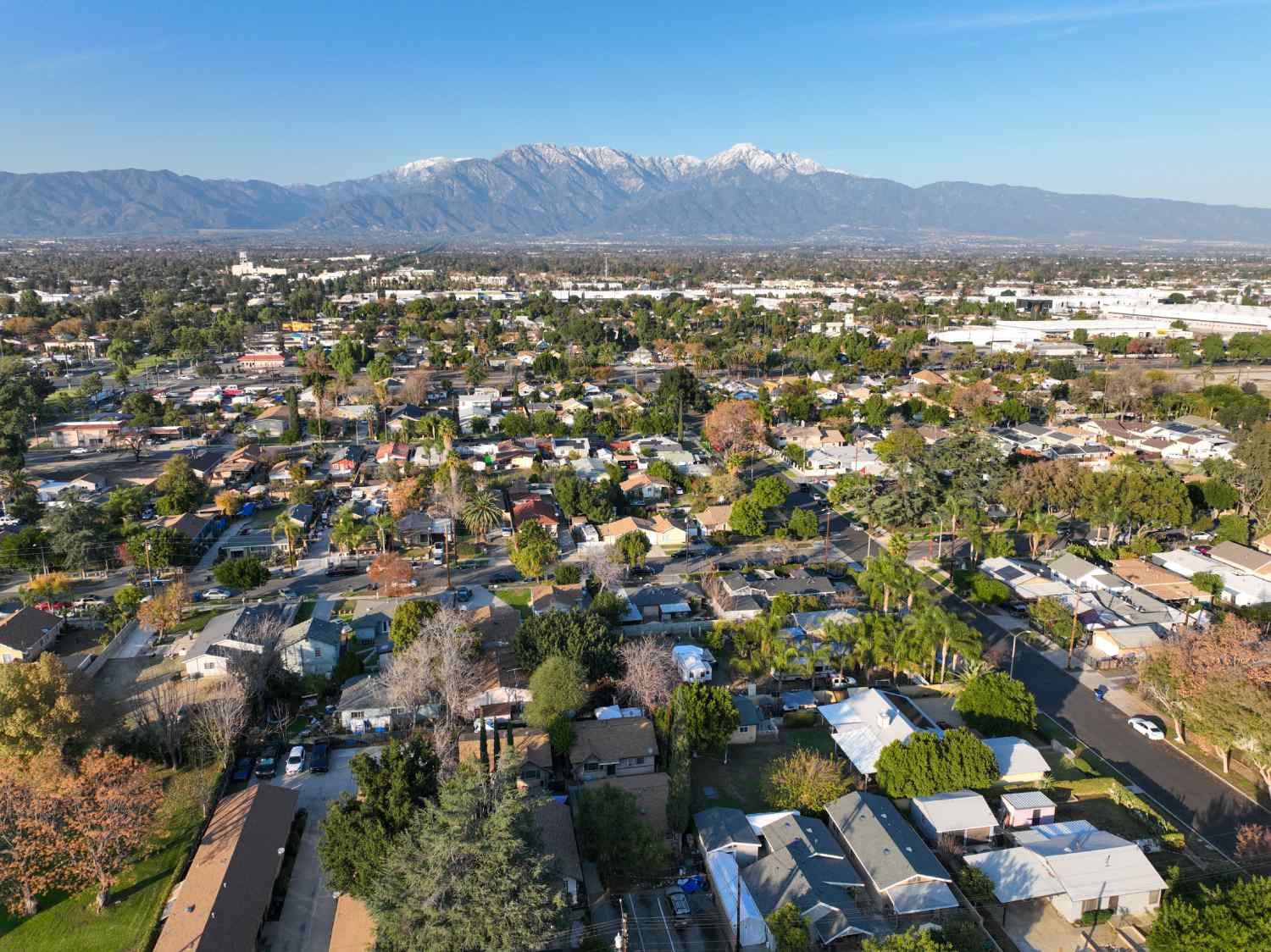 Aerial view of Ontario city in California with mountains in the background