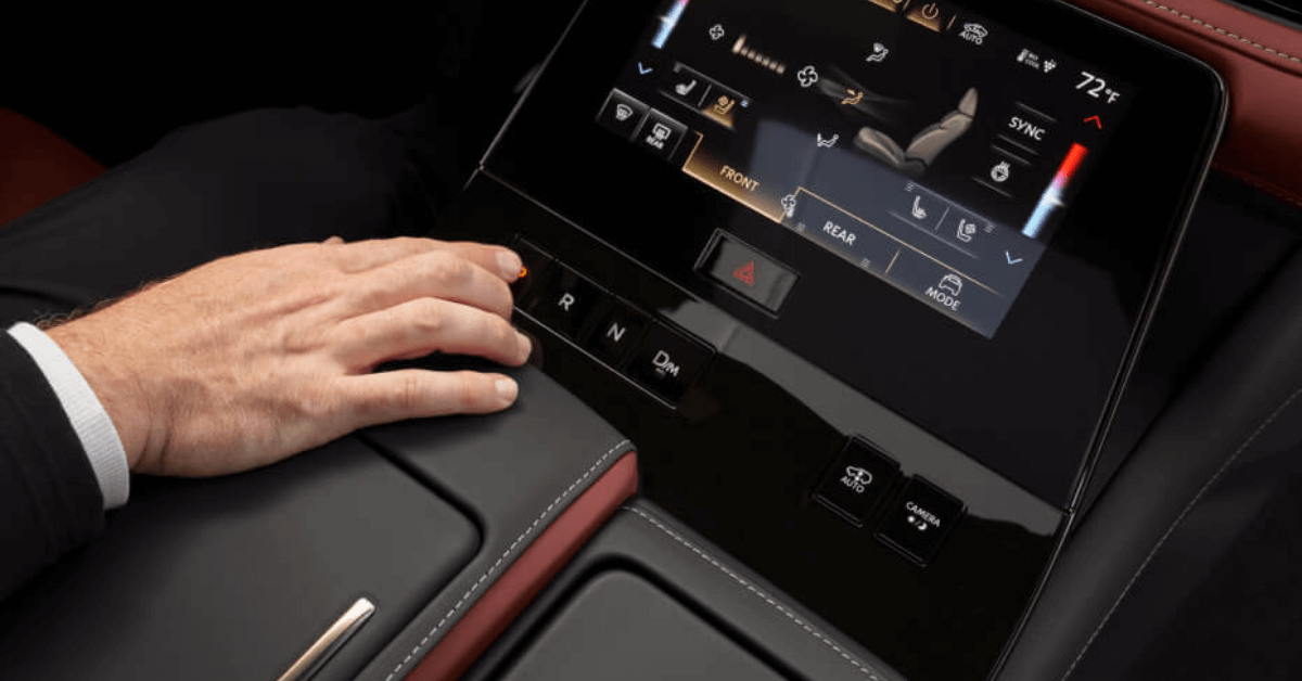 a hand operating the 2025 INFINITI QX80 touchscreen display