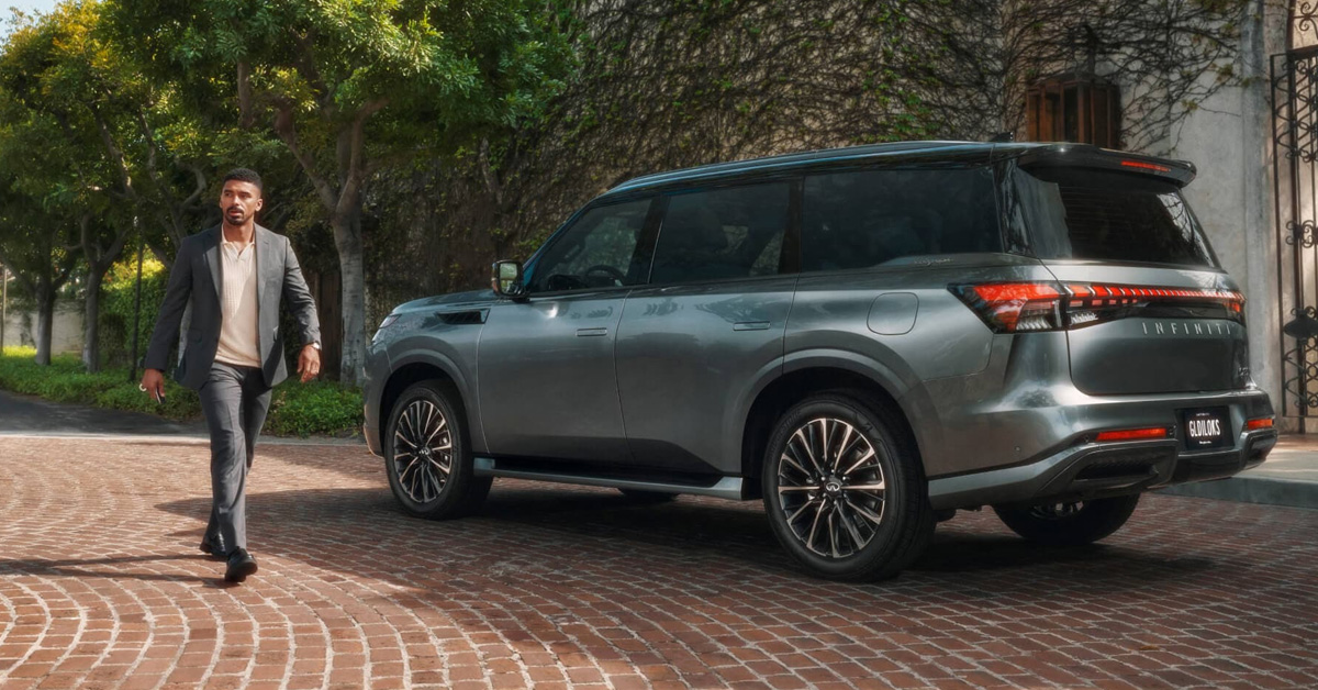 A man walking beside the 2026 INFINITI QX80