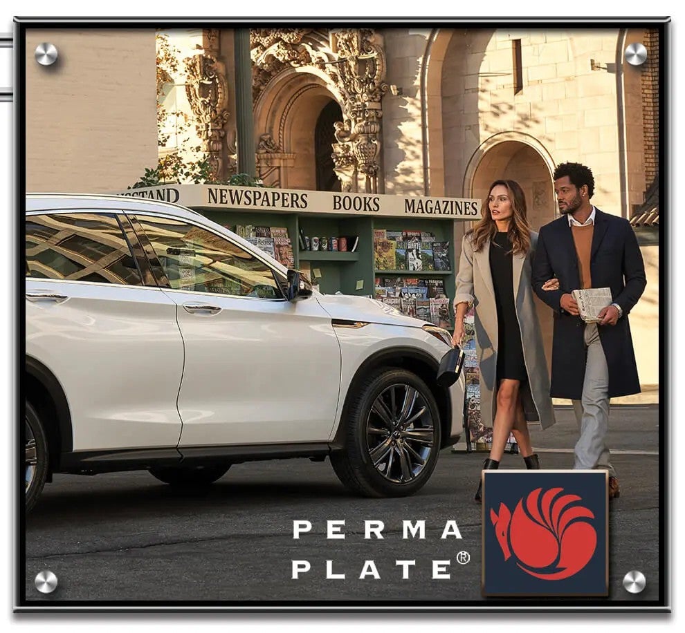 A white SUV is parked on a city street near an ornate stone building